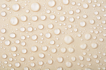 drops of water on a beige background