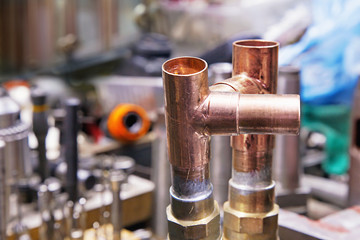 Copper pipes in blurry background