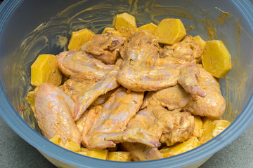 Marinated chicken wings with potatoes