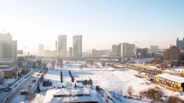 Novosibirsk, Russia. Aerial view of skyscrapers in Novosibirsk, Russia. Winter in Siberia in the morning. Cold weather. Time-lapse in winter, zoom