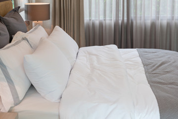 Fototapeta na wymiar classic bedroom style with set of pillows