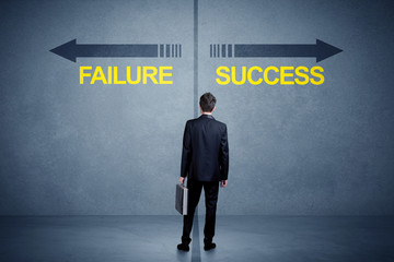 Businessman standing in front of success and failure arrow concept