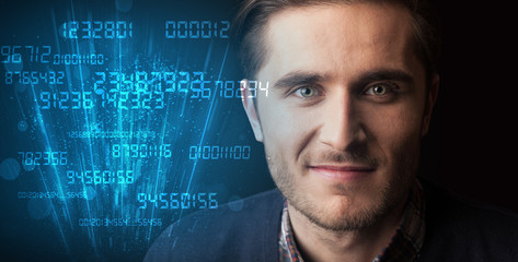 Portrait of a young businessman on dark background