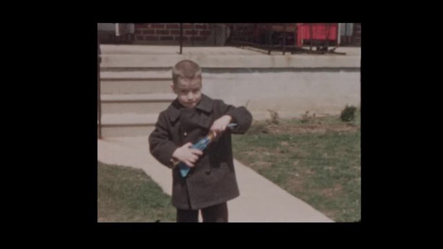 1956 Little boy with slingshot airplane