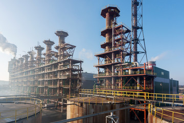 Chemical plant. Silos and smokestacks of a factory.