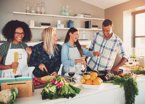 Four friends preparing for the party