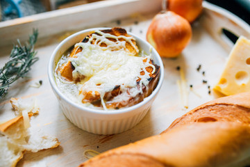 onion soup with croutons. On a wooden board
