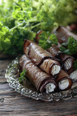 Eggplant rolls stuffed with cheese and garlic.