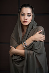 Fototapeta premium close-up portrait of beautiful young girl model with bright makeup, with jewelery with perfect clean skin