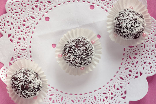 raw carob and coconut candies with dates and nuts , handmade. Vegan useful dessert