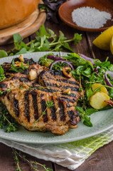 Grilled pork chops with lettuce salad