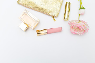 Cosmetics for make-up pink with gold on a white background. Copy space