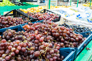 Grapes on the market. A lot of ripe grapes. 