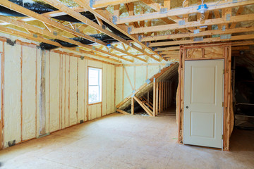 Heat isolation in new prefabricated house with mineral wool and wood. - obrazy, fototapety, plakaty