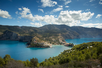 View of the city from the sea, moored yachts, reflection in the water. Greece, the island of Kafelonia.