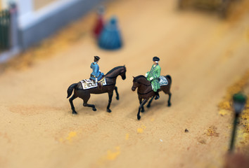 The world in miniature. Soldiers on horseback.