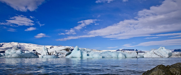 Iceberg Lagoon dotted with icebergs from the surrounding glacier, Iceland.
