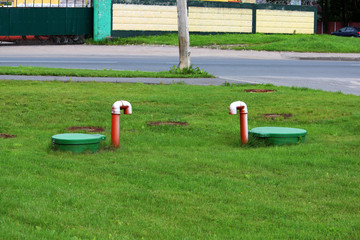 Tube of plastic tank gas oil catcher in the ground on the territory of the gas station, Russia