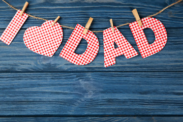 Obraz premium Composition with phrase I LOVE DAD for Father's Day on wooden background