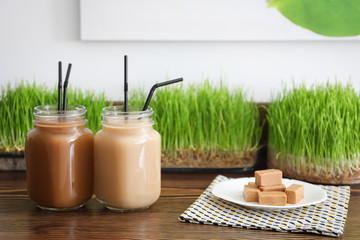 Mason jars with protein shake on counter in sport bar