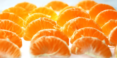 slices of tangerine on white background