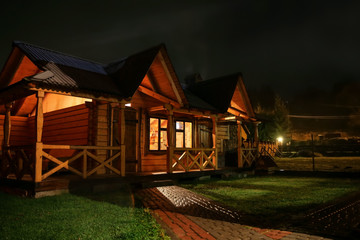 Comfortable log house for tourists in evening