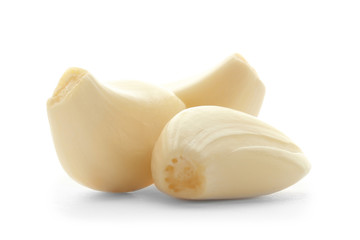 Fresh garlic cloves on white background