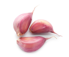 Fresh garlic cloves on white background
