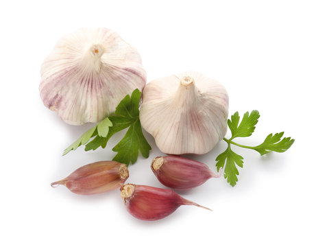Composition with fresh garlic and parsley on white background