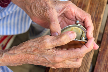 Old woman with an empty purse