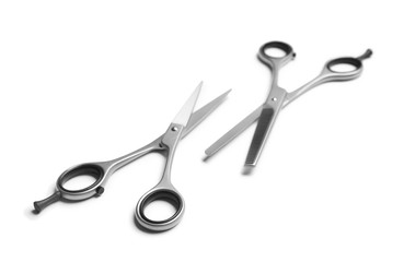 Professional hairdresser scissors on white background