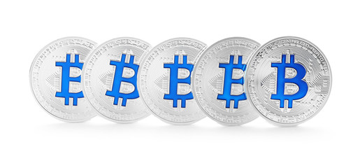 Silver bitcoins on white background