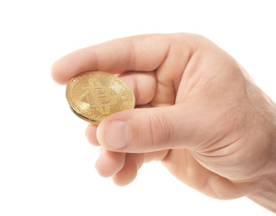 Male hand with golden bitcoin on white background