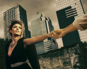 Couple portrait going to separate and dramatic cityscape