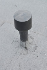 Flat roof ventilation, waterproofing ant protection . Aerator on Roofing felt. Closeup detail shoot.