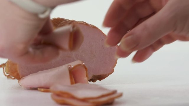 The process of food photography. Processed meat products. Photographer arranges food to create attractive still life pictures. Smoked ham with herbs.