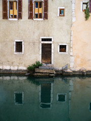 Fototapeta na wymiar Old Wooden Door with reflection in the water