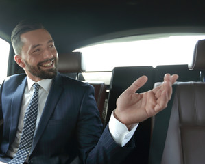 Confident businessman talking in car