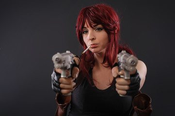Portrait of beautiful sexy woman with two gun