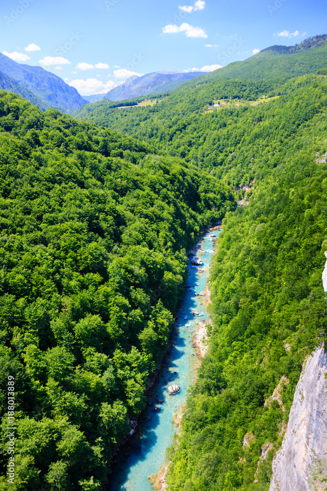 Wall mural  top view mountain river with crystal clear water among the green mountains