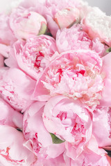 Elegant bouquet of a lot of peonies of pink color close up. Beautiful flower for any holiday. Lots of pretty and romantic flowers in floral shop.