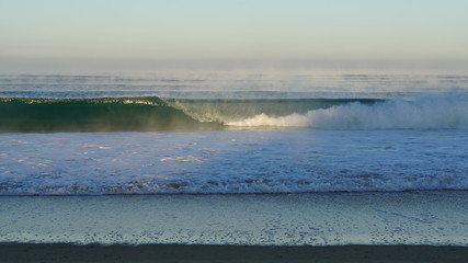dawn wave in the mist