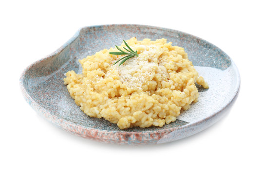 Plate with delicious risotto on white background