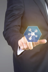 Close up of businessman touching medical icon with finger 