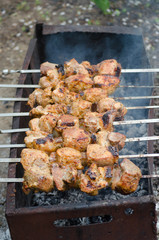 Process of grilling meat on open fire