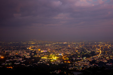 The view from the balcony to see the city and the dark sky in the night time and with some part of clouds after the rain stops.