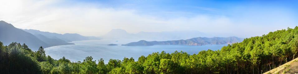 Fototapeta na wymiar Panorama landscape of Lugu Lake. It is an alpine lake at an elevation of 2,685 metres. Located in Yunnan, China.