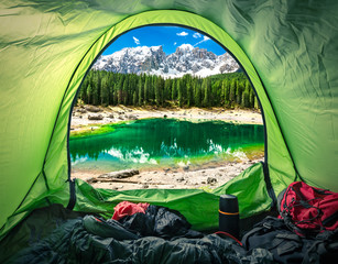 View from tent in mountain Carezza lake, Alps, Italy, Europe - obrazy, fototapety, plakaty