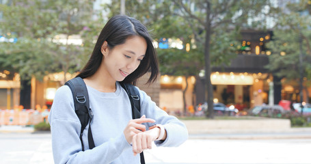 Woman using smart watch at outdoor