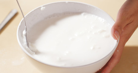 Fototapeta na wymiar Mixing flour with water and white powder